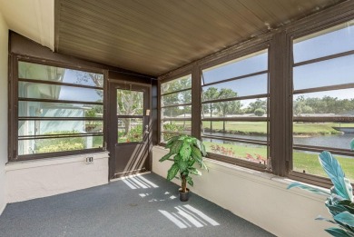 RARE OPPORTUNITY TO OWN A WATERFRONT CORNER VILLA NESTLED IN on Highland Lakes Executive Golf Course in Florida - for sale on GolfHomes.com, golf home, golf lot