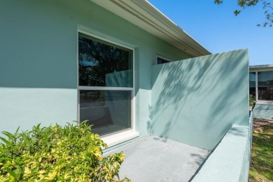 RARE OPPORTUNITY TO OWN A WATERFRONT CORNER VILLA NESTLED IN on Highland Lakes Executive Golf Course in Florida - for sale on GolfHomes.com, golf home, golf lot