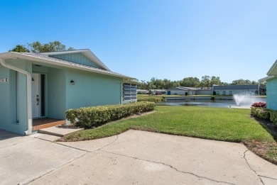 RARE OPPORTUNITY TO OWN A WATERFRONT CORNER VILLA NESTLED IN on Highland Lakes Executive Golf Course in Florida - for sale on GolfHomes.com, golf home, golf lot