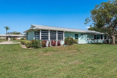 RARE OPPORTUNITY TO OWN A WATERFRONT CORNER VILLA NESTLED IN on Highland Lakes Executive Golf Course in Florida - for sale on GolfHomes.com, golf home, golf lot