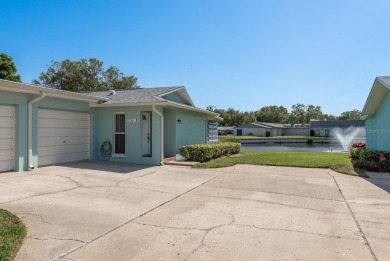 RARE OPPORTUNITY TO OWN A WATERFRONT CORNER VILLA NESTLED IN on Highland Lakes Executive Golf Course in Florida - for sale on GolfHomes.com, golf home, golf lot