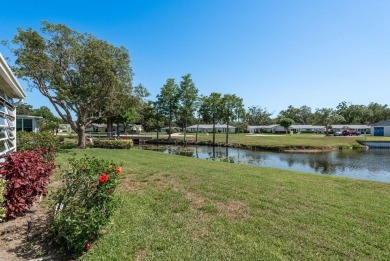 RARE OPPORTUNITY TO OWN A WATERFRONT CORNER VILLA NESTLED IN on Highland Lakes Executive Golf Course in Florida - for sale on GolfHomes.com, golf home, golf lot