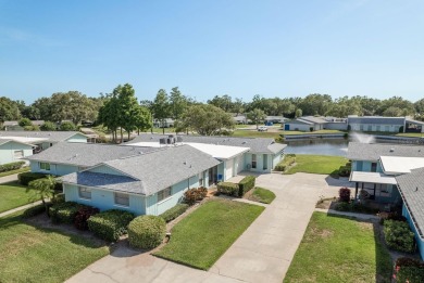 RARE OPPORTUNITY TO OWN A WATERFRONT CORNER VILLA NESTLED IN on Highland Lakes Executive Golf Course in Florida - for sale on GolfHomes.com, golf home, golf lot