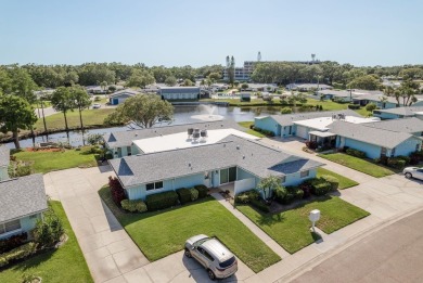 RARE OPPORTUNITY TO OWN A WATERFRONT CORNER VILLA NESTLED IN on Highland Lakes Executive Golf Course in Florida - for sale on GolfHomes.com, golf home, golf lot