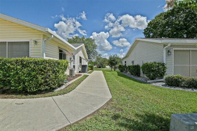 Priced Below Market--Investor or Handyman Special! This split on The Links of Spruce Creek in Florida - for sale on GolfHomes.com, golf home, golf lot