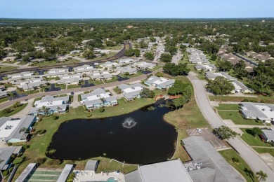 RARE OPPORTUNITY TO OWN A WATERFRONT CORNER VILLA NESTLED IN on Highland Lakes Executive Golf Course in Florida - for sale on GolfHomes.com, golf home, golf lot