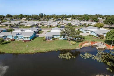 RARE OPPORTUNITY TO OWN A WATERFRONT CORNER VILLA NESTLED IN on Highland Lakes Executive Golf Course in Florida - for sale on GolfHomes.com, golf home, golf lot