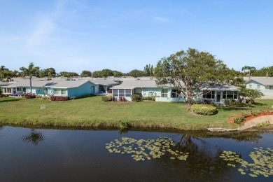 RARE OPPORTUNITY TO OWN A WATERFRONT CORNER VILLA NESTLED IN on Highland Lakes Executive Golf Course in Florida - for sale on GolfHomes.com, golf home, golf lot