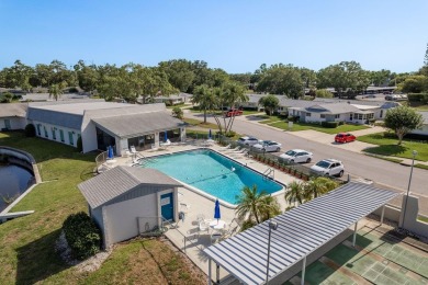 RARE OPPORTUNITY TO OWN A WATERFRONT CORNER VILLA NESTLED IN on Highland Lakes Executive Golf Course in Florida - for sale on GolfHomes.com, golf home, golf lot