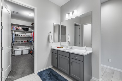 PRICED BELOW MARKET - MOVE-IN READY WITH OVER $73K IN BUILDER on Poston Butte Golf Club in Arizona - for sale on GolfHomes.com, golf home, golf lot