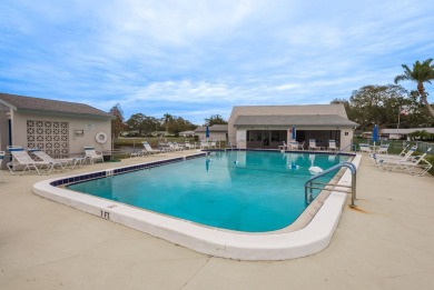 RARE OPPORTUNITY TO OWN A WATERFRONT CORNER VILLA NESTLED IN on Highland Lakes Executive Golf Course in Florida - for sale on GolfHomes.com, golf home, golf lot