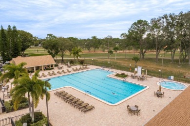 RARE OPPORTUNITY TO OWN A WATERFRONT CORNER VILLA NESTLED IN on Highland Lakes Executive Golf Course in Florida - for sale on GolfHomes.com, golf home, golf lot