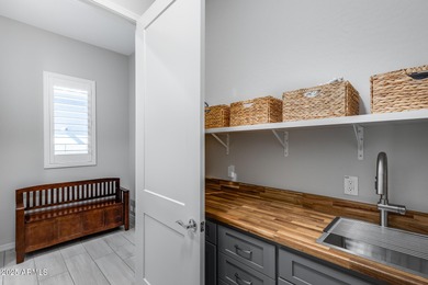 PRICED BELOW MARKET - MOVE-IN READY WITH OVER $73K IN BUILDER on Poston Butte Golf Club in Arizona - for sale on GolfHomes.com, golf home, golf lot