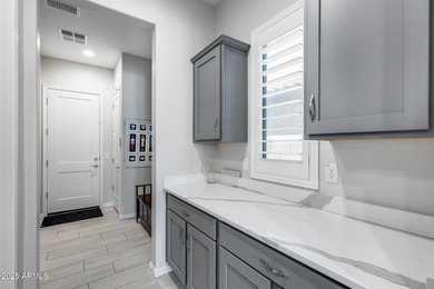 PRICED BELOW MARKET - MOVE-IN READY WITH OVER $73K IN BUILDER on Poston Butte Golf Club in Arizona - for sale on GolfHomes.com, golf home, golf lot