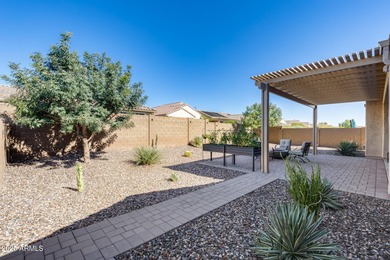 PRICED BELOW MARKET - MOVE-IN READY WITH OVER $73K IN BUILDER on Poston Butte Golf Club in Arizona - for sale on GolfHomes.com, golf home, golf lot