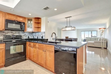 FULLY UPDATED UNIT BOASTING FULL IMPACT WINDOWS, DOORS & PATIO! on Wynmoor Golf Course in Florida - for sale on GolfHomes.com, golf home, golf lot