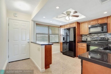 FULLY UPDATED UNIT BOASTING FULL IMPACT WINDOWS, DOORS & PATIO! on Wynmoor Golf Course in Florida - for sale on GolfHomes.com, golf home, golf lot