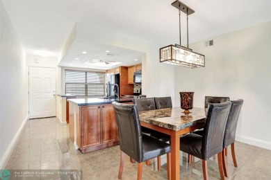 FULLY UPDATED UNIT BOASTING FULL IMPACT WINDOWS, DOORS & PATIO! on Wynmoor Golf Course in Florida - for sale on GolfHomes.com, golf home, golf lot