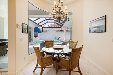 This exceptional 3-bedroom plus den, 3.5-bathroom estate home in on West Bay Beach and Golf Club in Florida - for sale on GolfHomes.com, golf home, golf lot