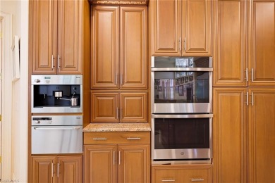 This exceptional 3-bedroom plus den, 3.5-bathroom estate home in on West Bay Beach and Golf Club in Florida - for sale on GolfHomes.com, golf home, golf lot