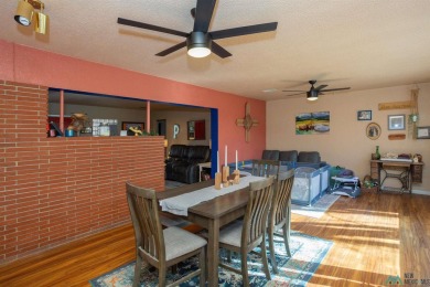 Cheerful, warm and inviting, this unique home is brimming with on Spring River Golf Course in New Mexico - for sale on GolfHomes.com, golf home, golf lot