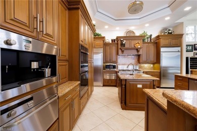 This exceptional 3-bedroom plus den, 3.5-bathroom estate home in on West Bay Beach and Golf Club in Florida - for sale on GolfHomes.com, golf home, golf lot