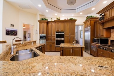 This exceptional 3-bedroom plus den, 3.5-bathroom estate home in on West Bay Beach and Golf Club in Florida - for sale on GolfHomes.com, golf home, golf lot