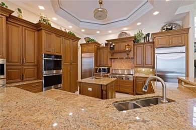 This exceptional 3-bedroom plus den, 3.5-bathroom estate home in on West Bay Beach and Golf Club in Florida - for sale on GolfHomes.com, golf home, golf lot