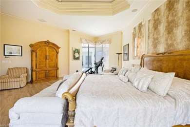 This exceptional 3-bedroom plus den, 3.5-bathroom estate home in on West Bay Beach and Golf Club in Florida - for sale on GolfHomes.com, golf home, golf lot