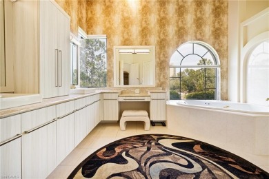 This exceptional 3-bedroom plus den, 3.5-bathroom estate home in on West Bay Beach and Golf Club in Florida - for sale on GolfHomes.com, golf home, golf lot