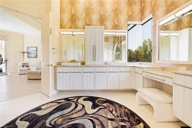 This exceptional 3-bedroom plus den, 3.5-bathroom estate home in on West Bay Beach and Golf Club in Florida - for sale on GolfHomes.com, golf home, golf lot