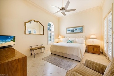 This exceptional 3-bedroom plus den, 3.5-bathroom estate home in on West Bay Beach and Golf Club in Florida - for sale on GolfHomes.com, golf home, golf lot