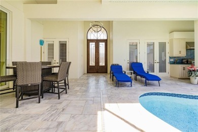 This exceptional 3-bedroom plus den, 3.5-bathroom estate home in on West Bay Beach and Golf Club in Florida - for sale on GolfHomes.com, golf home, golf lot
