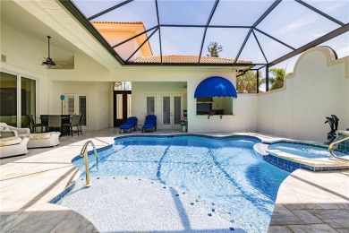 This exceptional 3-bedroom plus den, 3.5-bathroom estate home in on West Bay Beach and Golf Club in Florida - for sale on GolfHomes.com, golf home, golf lot