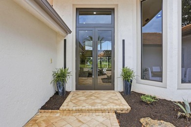 Exquisitely renovated 4BR/4BA lakefront estate in the desirable on  in Florida - for sale on GolfHomes.com, golf home, golf lot