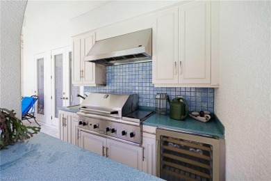 This exceptional 3-bedroom plus den, 3.5-bathroom estate home in on West Bay Beach and Golf Club in Florida - for sale on GolfHomes.com, golf home, golf lot