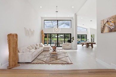 Exquisitely renovated 4BR/4BA lakefront estate in the desirable on  in Florida - for sale on GolfHomes.com, golf home, golf lot