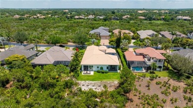 This exceptional 3-bedroom plus den, 3.5-bathroom estate home in on West Bay Beach and Golf Club in Florida - for sale on GolfHomes.com, golf home, golf lot