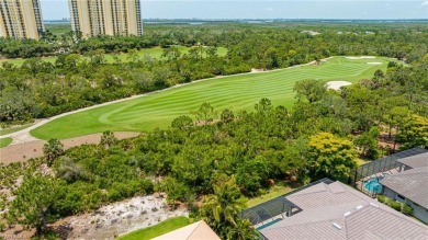 This exceptional 3-bedroom plus den, 3.5-bathroom estate home in on West Bay Beach and Golf Club in Florida - for sale on GolfHomes.com, golf home, golf lot