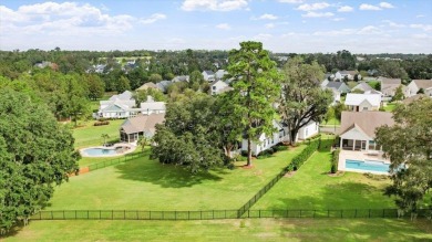 One of Southwood's finest multi-generational estates, perfectly on Southwood Golf Club in Florida - for sale on GolfHomes.com, golf home, golf lot