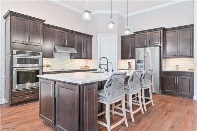 Elegant 4-Bedroom + Den Estate with Heated Pool, Extended 3-Car on Old Corkscrew Golf Club in Florida - for sale on GolfHomes.com, golf home, golf lot