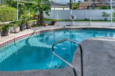 Experience refined Florida living in this meticulously on The Grand Club - Pine Lakes Course in Florida - for sale on GolfHomes.com, golf home, golf lot