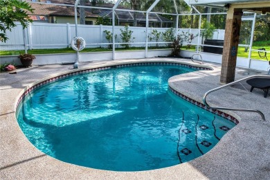 Experience refined Florida living in this meticulously on The Grand Club - Pine Lakes Course in Florida - for sale on GolfHomes.com, golf home, golf lot