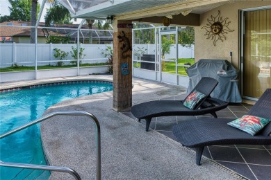 Experience refined Florida living in this meticulously on The Grand Club - Pine Lakes Course in Florida - for sale on GolfHomes.com, golf home, golf lot