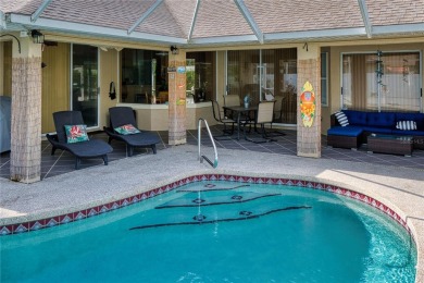 Experience refined Florida living in this meticulously on The Grand Club - Pine Lakes Course in Florida - for sale on GolfHomes.com, golf home, golf lot