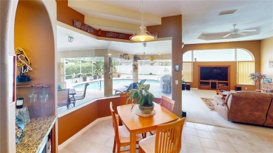 Experience refined Florida living in this meticulously on The Grand Club - Pine Lakes Course in Florida - for sale on GolfHomes.com, golf home, golf lot