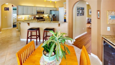 Experience refined Florida living in this meticulously on The Grand Club - Pine Lakes Course in Florida - for sale on GolfHomes.com, golf home, golf lot