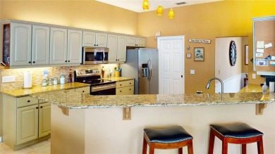 Experience refined Florida living in this meticulously on The Grand Club - Pine Lakes Course in Florida - for sale on GolfHomes.com, golf home, golf lot
