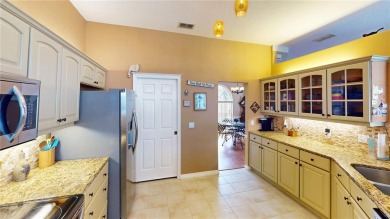 Experience refined Florida living in this meticulously on The Grand Club - Pine Lakes Course in Florida - for sale on GolfHomes.com, golf home, golf lot