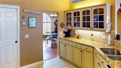 Experience refined Florida living in this meticulously on The Grand Club - Pine Lakes Course in Florida - for sale on GolfHomes.com, golf home, golf lot